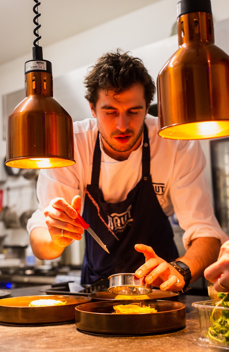 Chef Marco Bellini in his kitchen, expertly preparing a signature Italian dish